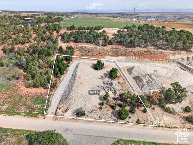 Open lot with natural vegetation and visible perimeter outlining "Tract A"