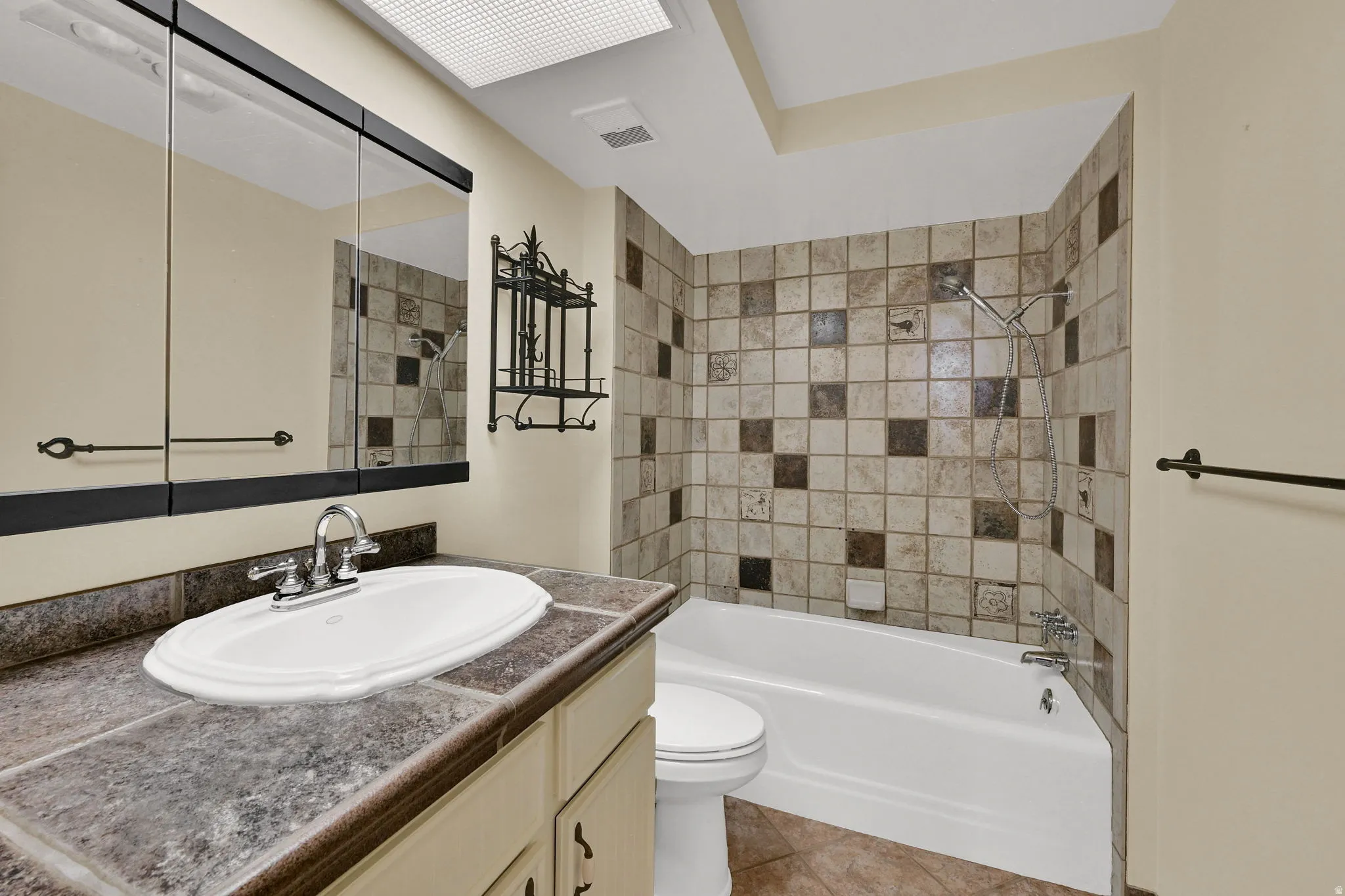 Vanity with integrated sink, tile countertop, and medicine cabinet