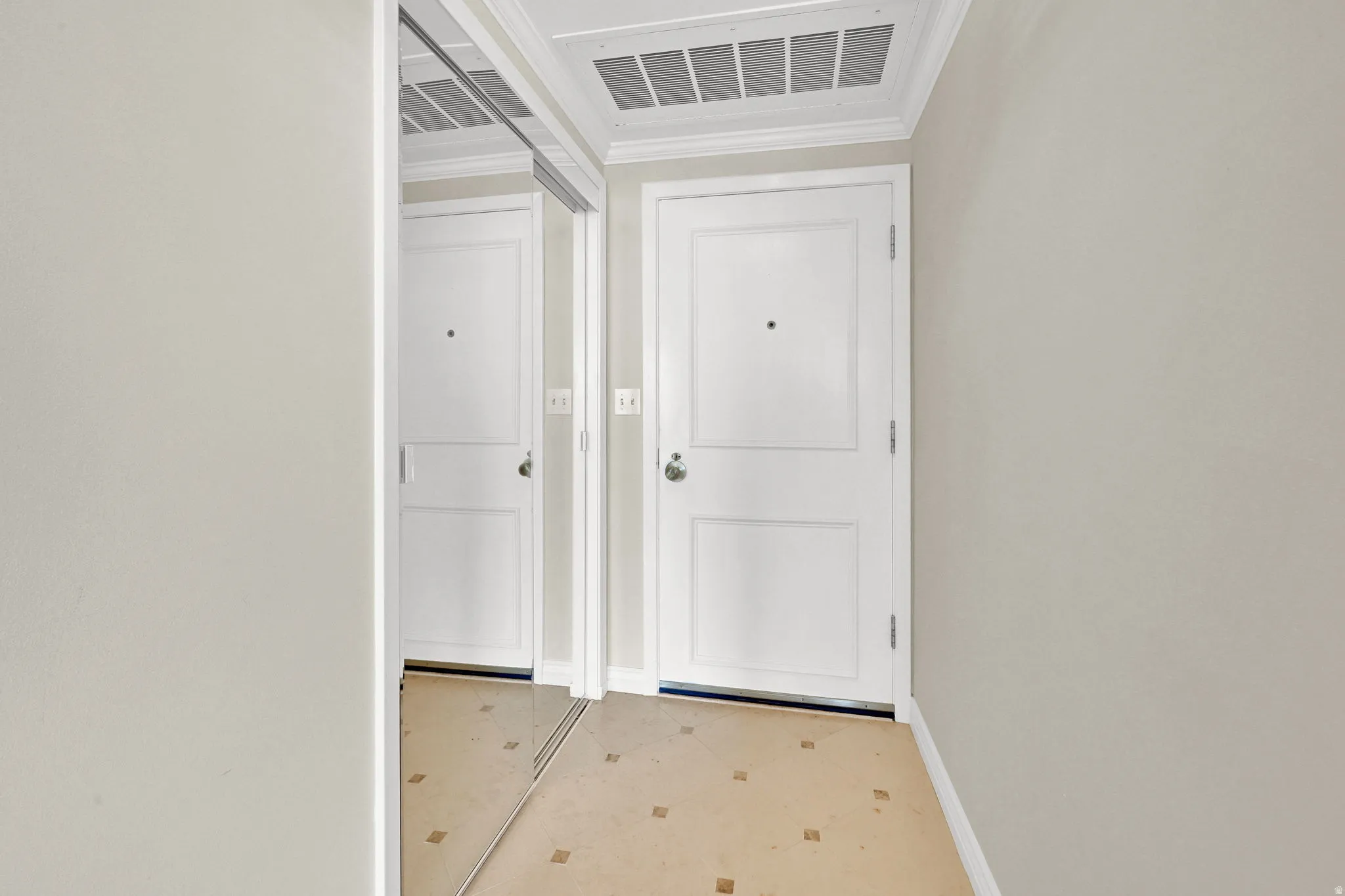 White paneled doors with chrome hardware