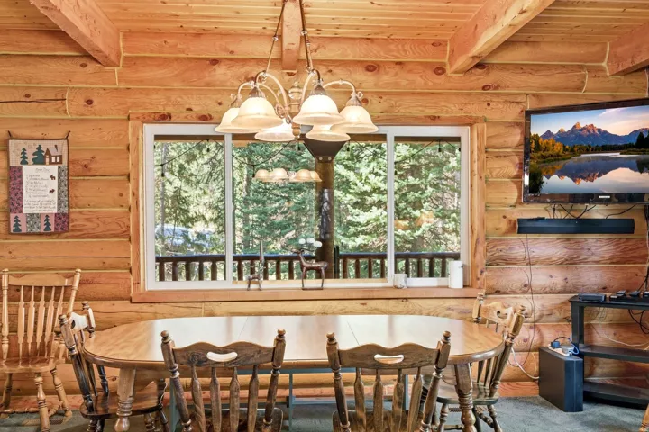 Natural wood log walls and exposed wood ceiling beams