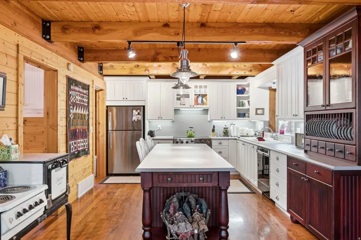 Wood-finish flooring with exposed wood beam ceiling