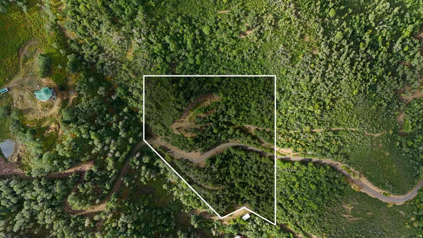 Aerial View. Depicting the property boundaries within a natural landscape