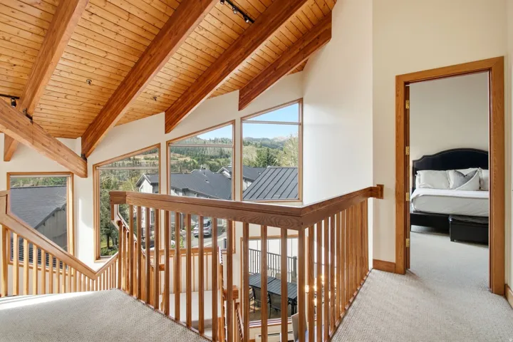 Vaulted wood-paneled ceiling with exposed beams