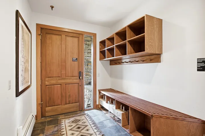 Solid wood entry door with a stacked stone sidelight