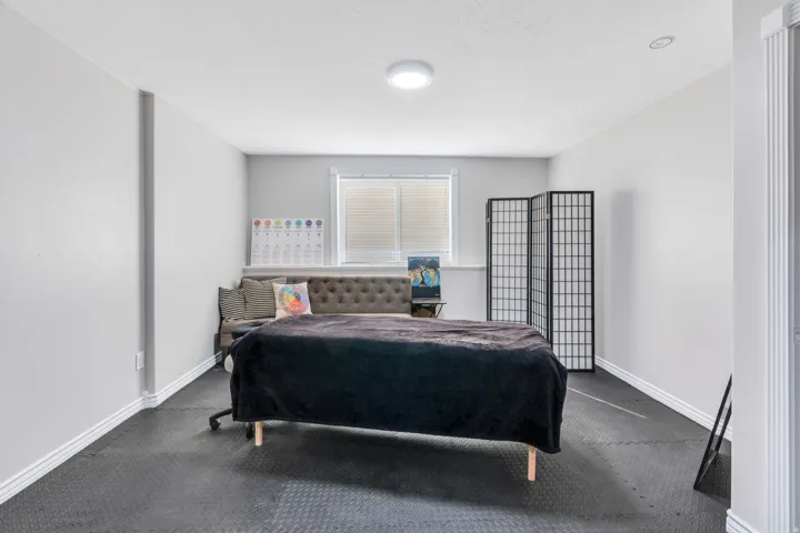 Recessed window, modern flush-mount lighting, and durable interlocking floor tiles