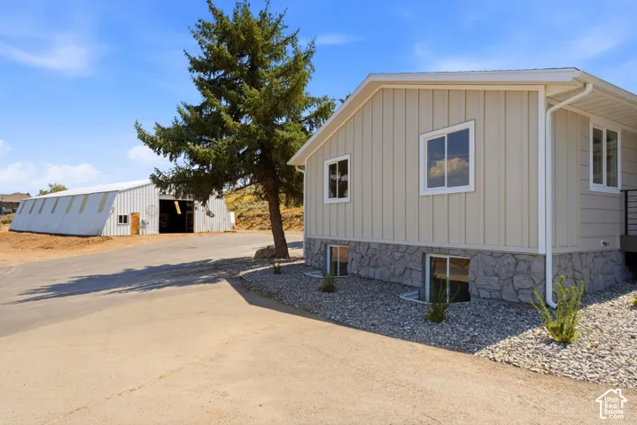 Board-and-batten siding with a stone veneer foundation