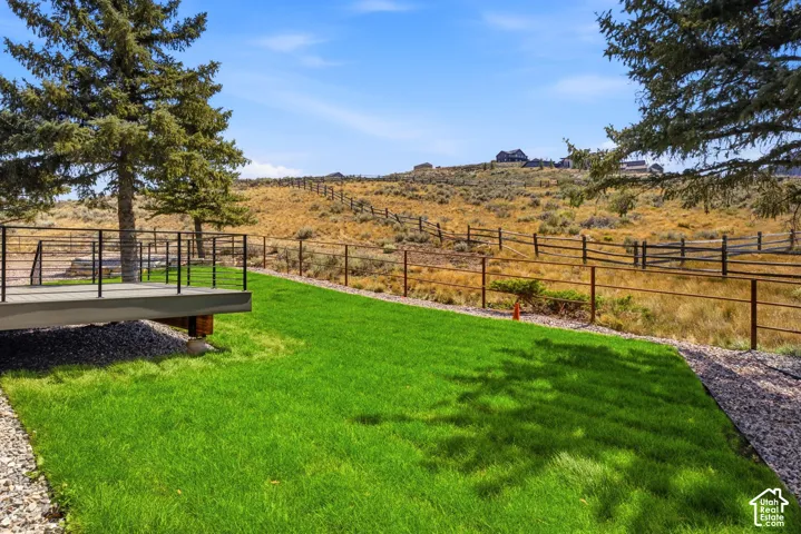 Expansive lawn with surrounding gravel border