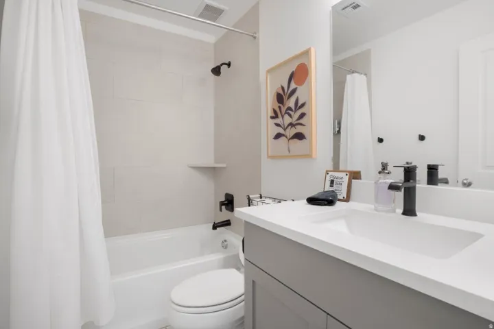 White integrated sink with a light grey vanity