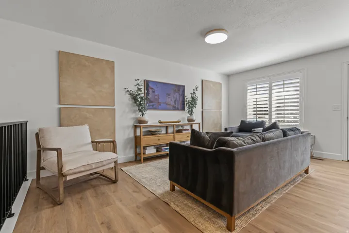 Sophisticated living space showcasing hardwood finish flooring.