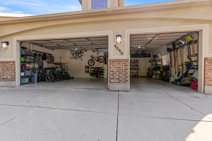 Three-car garage with space for shelving and storage.