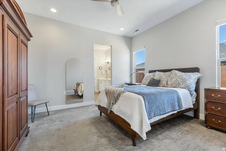 Recessed lighting, sloped ceiling, and multiple windows
