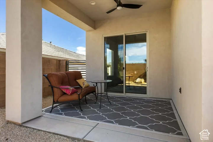 Covered patio featuring a ceiling fan, recessed lighting, and a sliding glass door