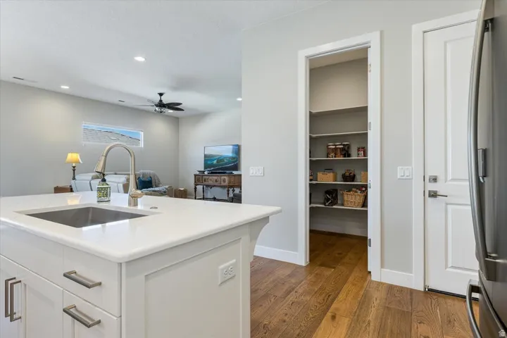 Kitchen island with an undermount sink and a gooseneck faucet