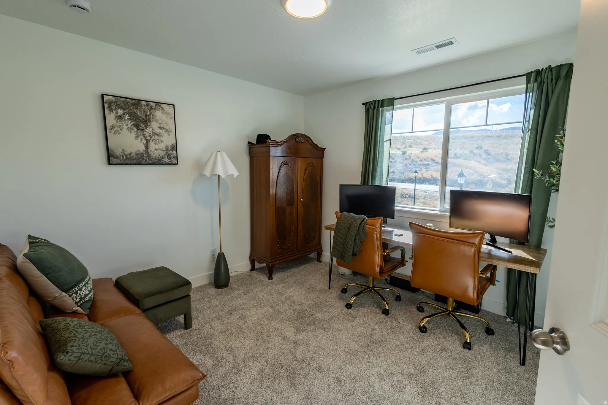 Carpeted room with a double window, built-in recessed lighting, and a prominent wardrobe