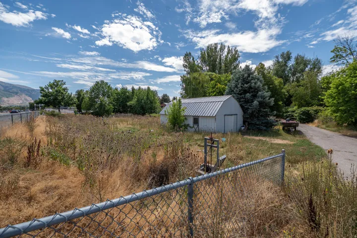 Chain-link fence enclosing a large parcel of land