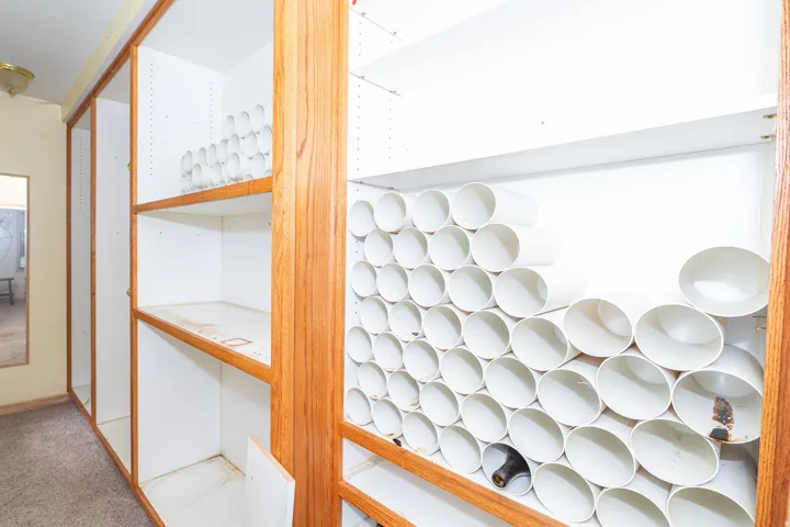 Built-in shelving units with wood-finish trim and white interiors
