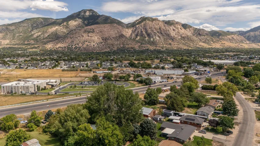 Mountain backdrop with scattered residential structures and various commercial buildings