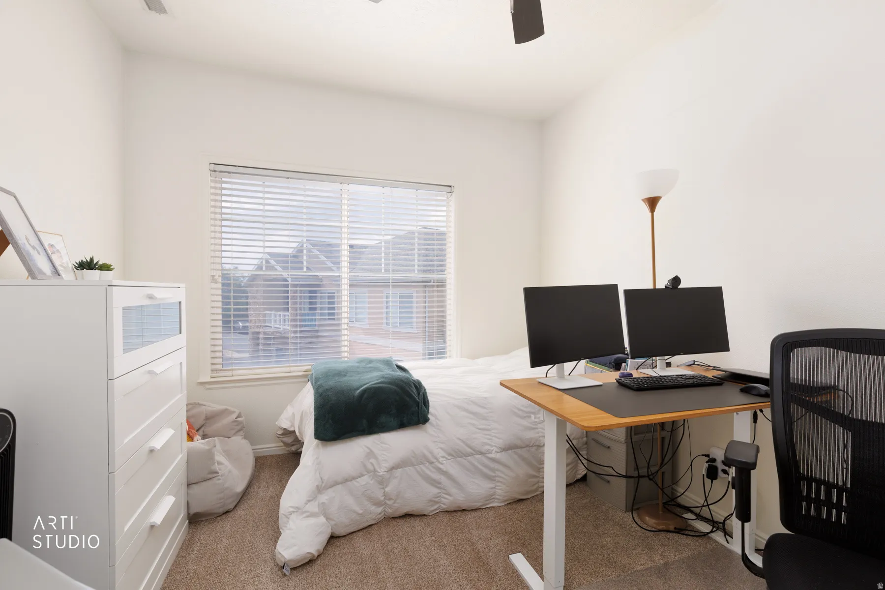 Carpeted flooring, window with blinds, ceiling fan, and white walls