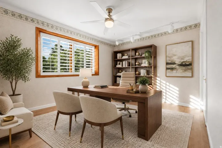 Wood-finish flooring, a ceiling fan with integrated lighting, and a large window with plantation shutters