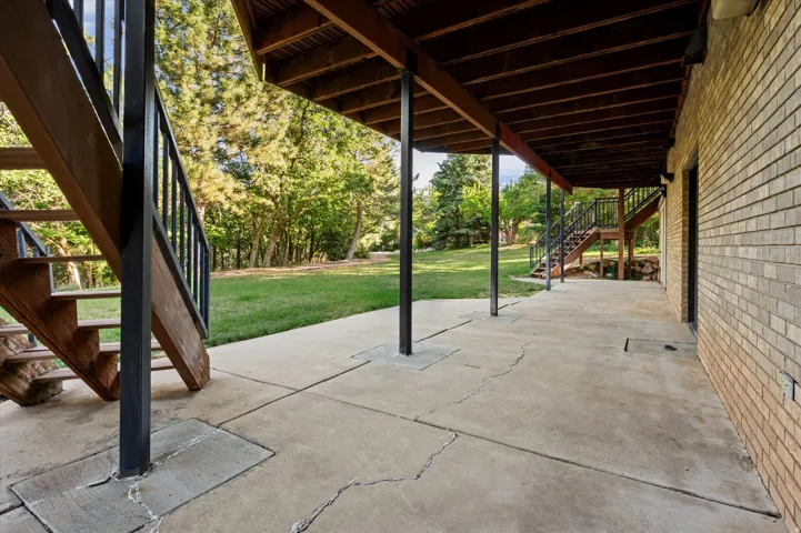 Expansive covered patio off of recreation room