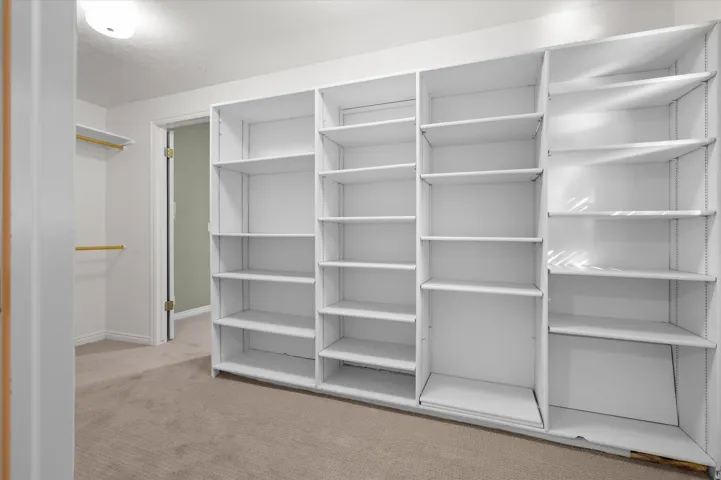 Integrated white shelving system with adjustable shelves