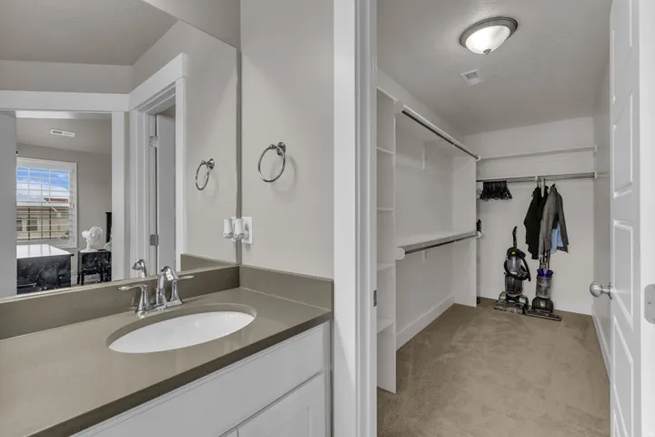 Bathroom vanity with an integrated sink and chrome faucet