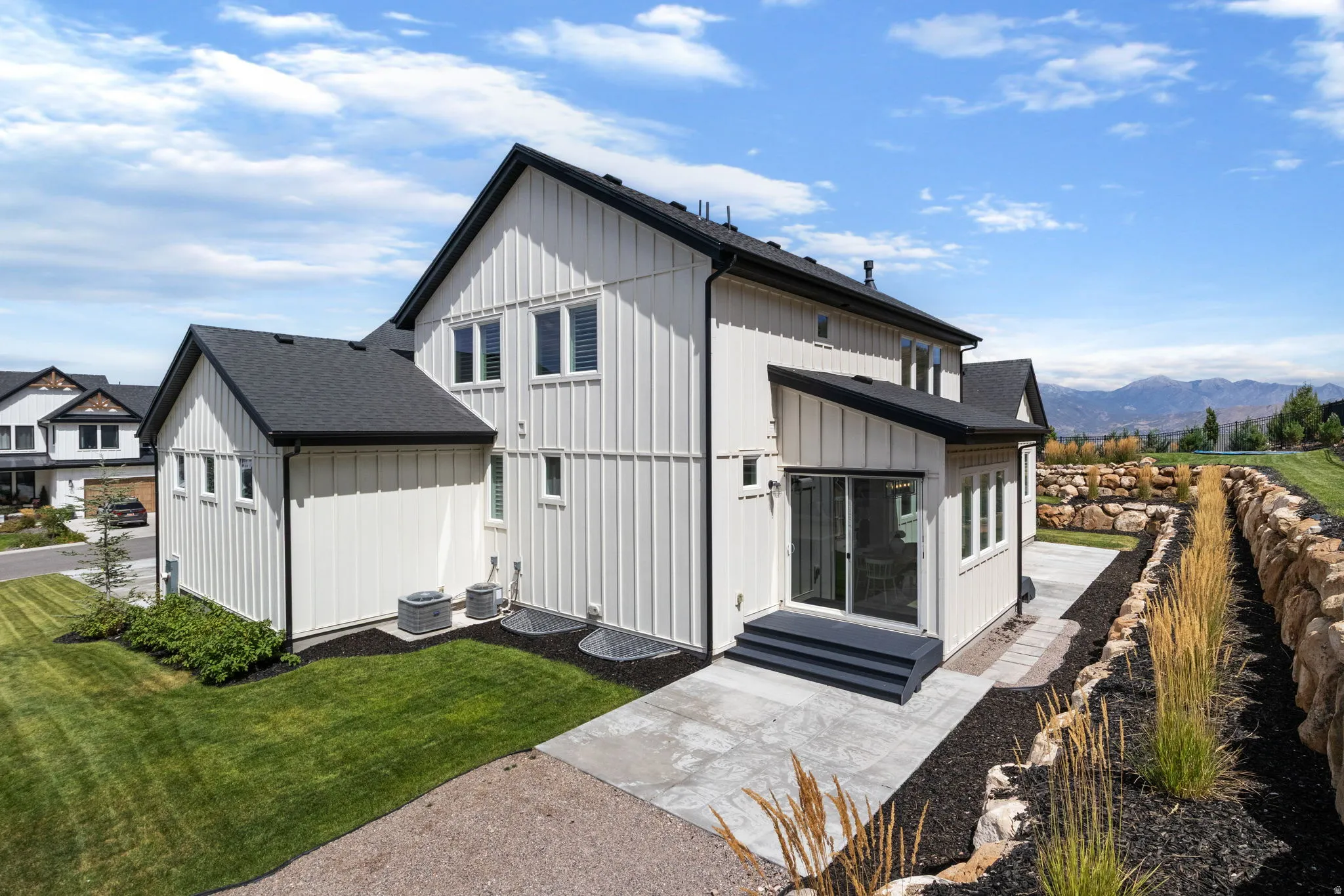 White board and batten exterior with black-framed windows