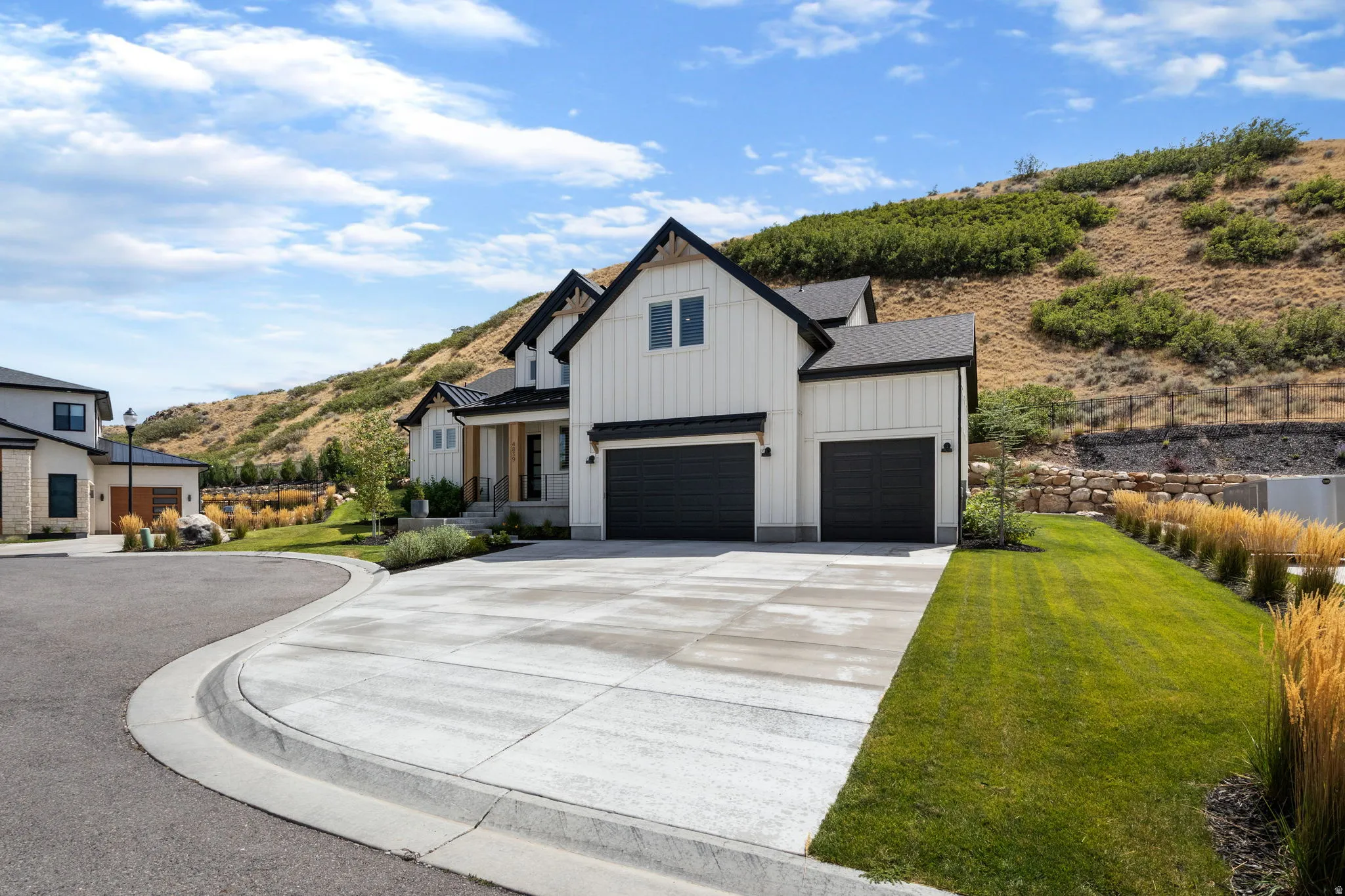 White vertical siding exterior with contrasting black trim