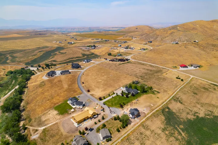 Expansive rural setting featuring rolling hills and scattered residential properties