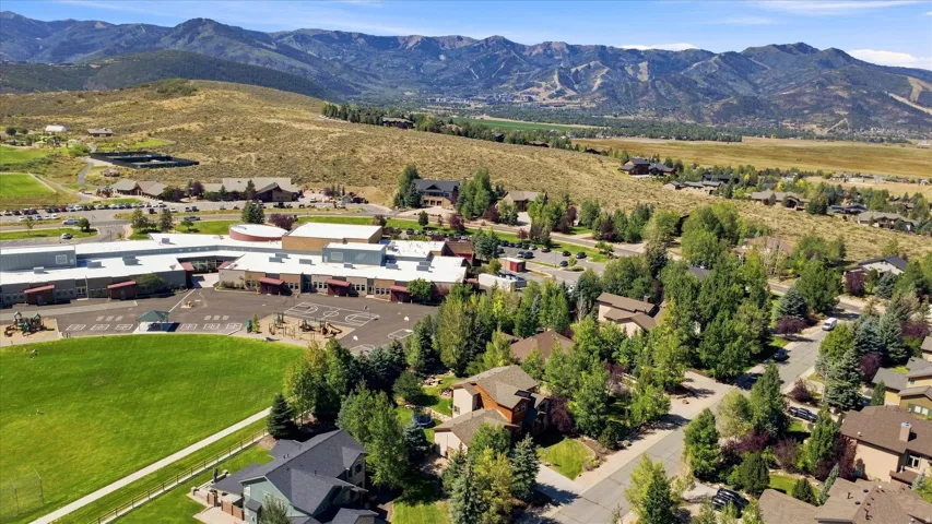 Expansive mountain scenery with diverse residential architecture and significant green spaces