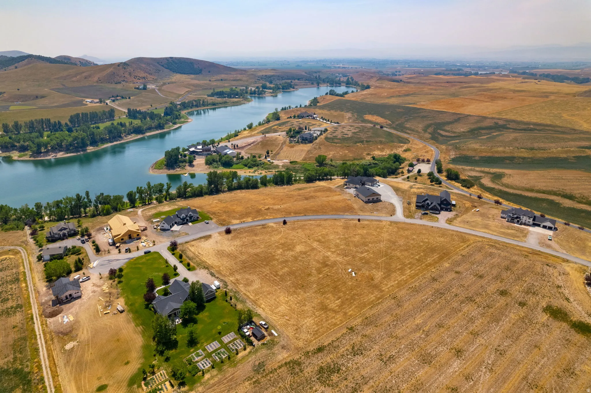 Waterfront properties with surrounding hills and residential development