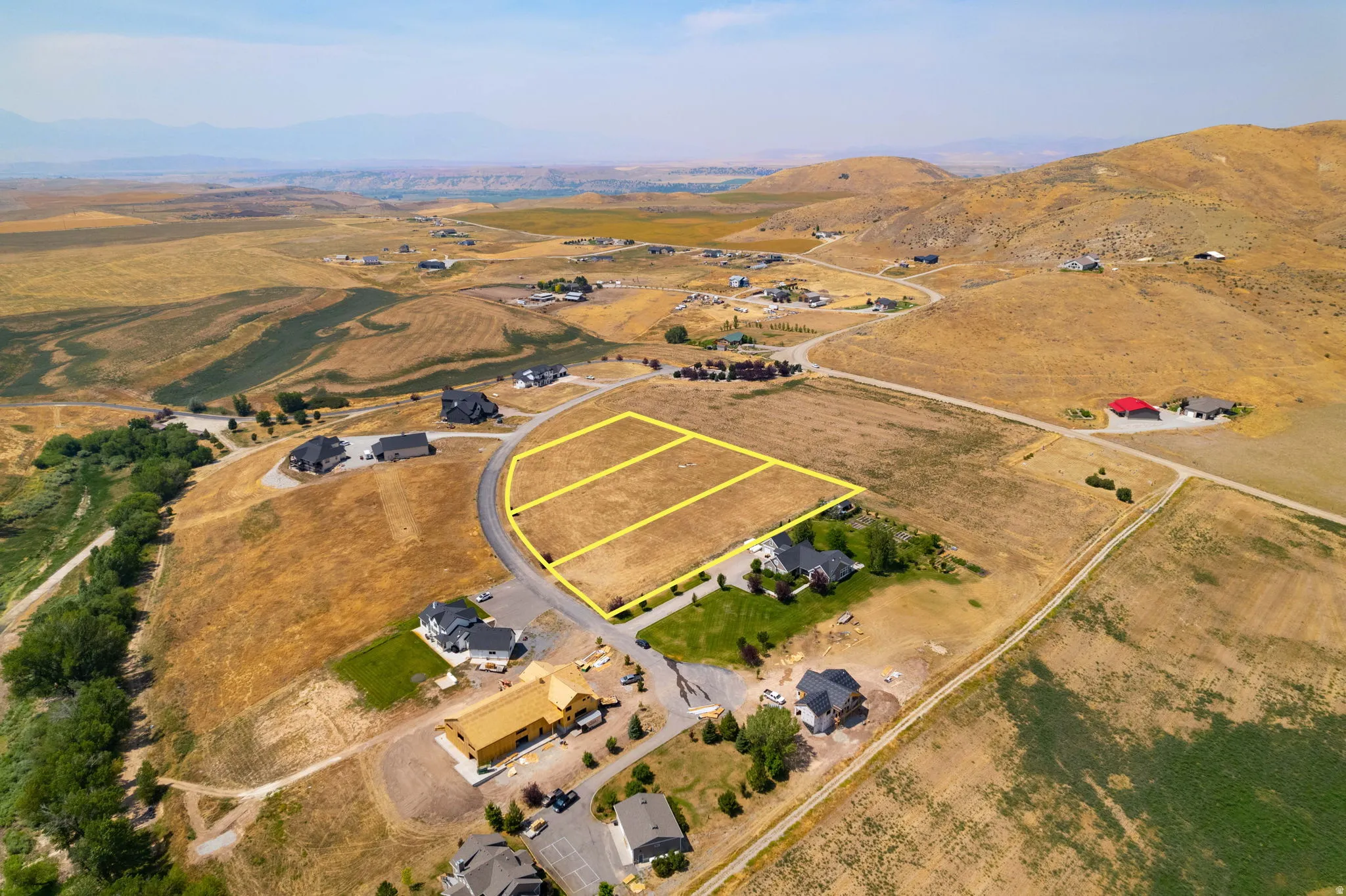 Multiple land parcels with marked boundaries, surrounded by established residential properties