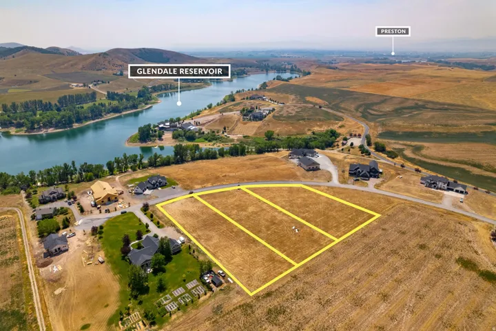 Aerial perspective of multiple undeveloped land parcels with defined boundaries
