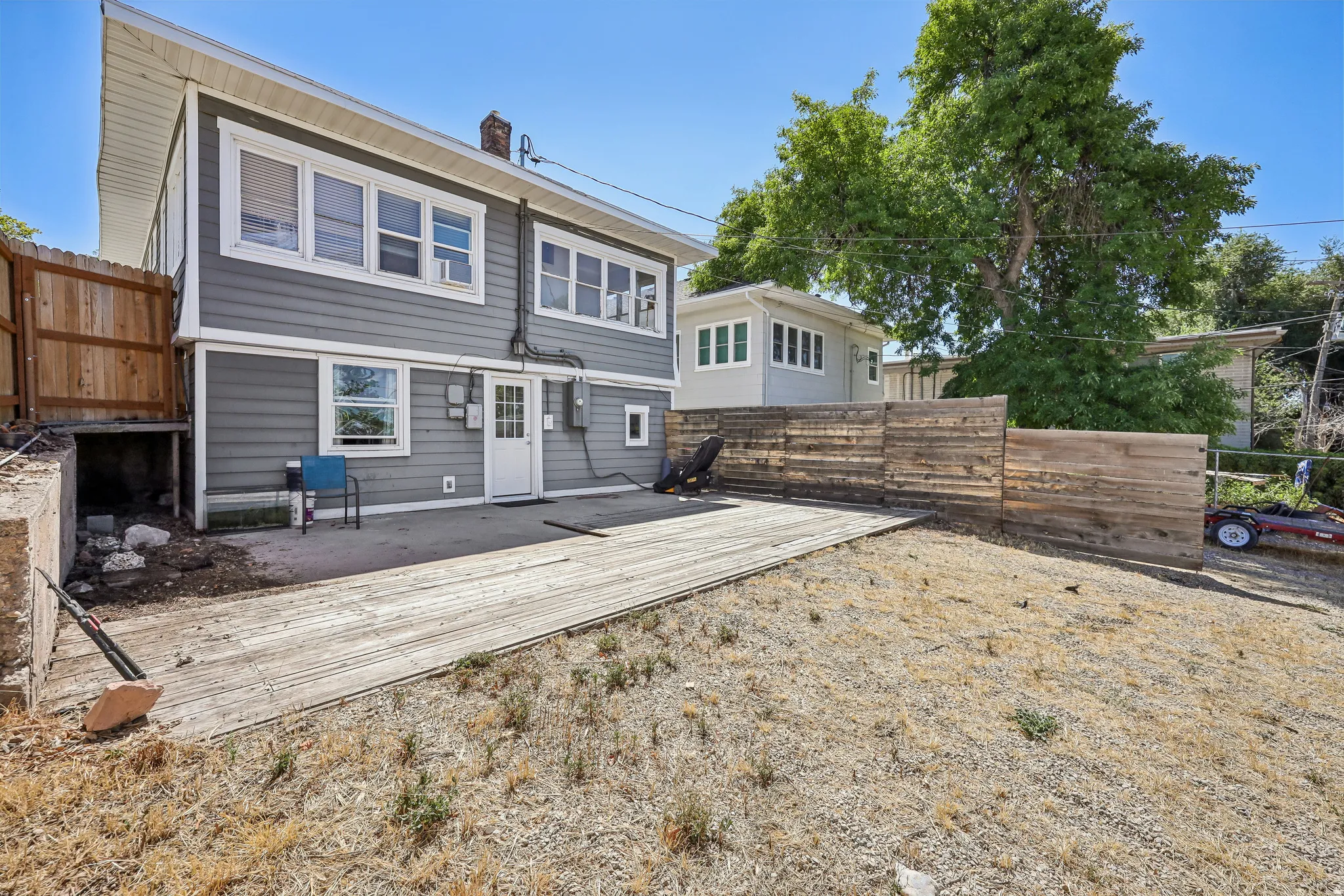 Two-story residence with gray siding and white trim