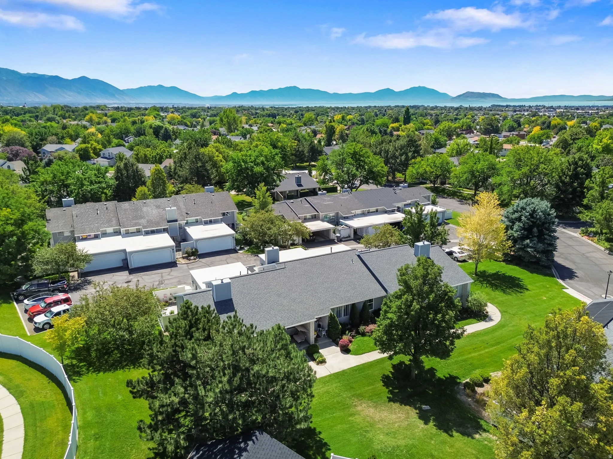 Expansive neighborhood with abundant mature trees and mountainous backdrop