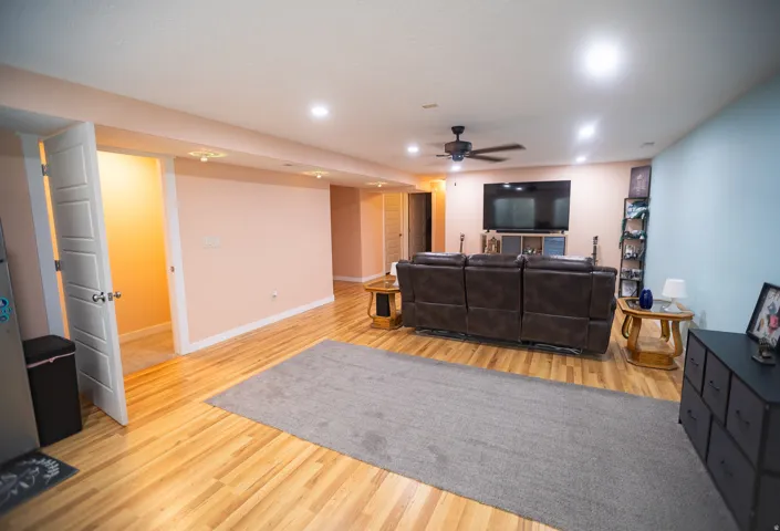 Recessed lighting, wood-finish flooring, ceiling fan, and paneled doors