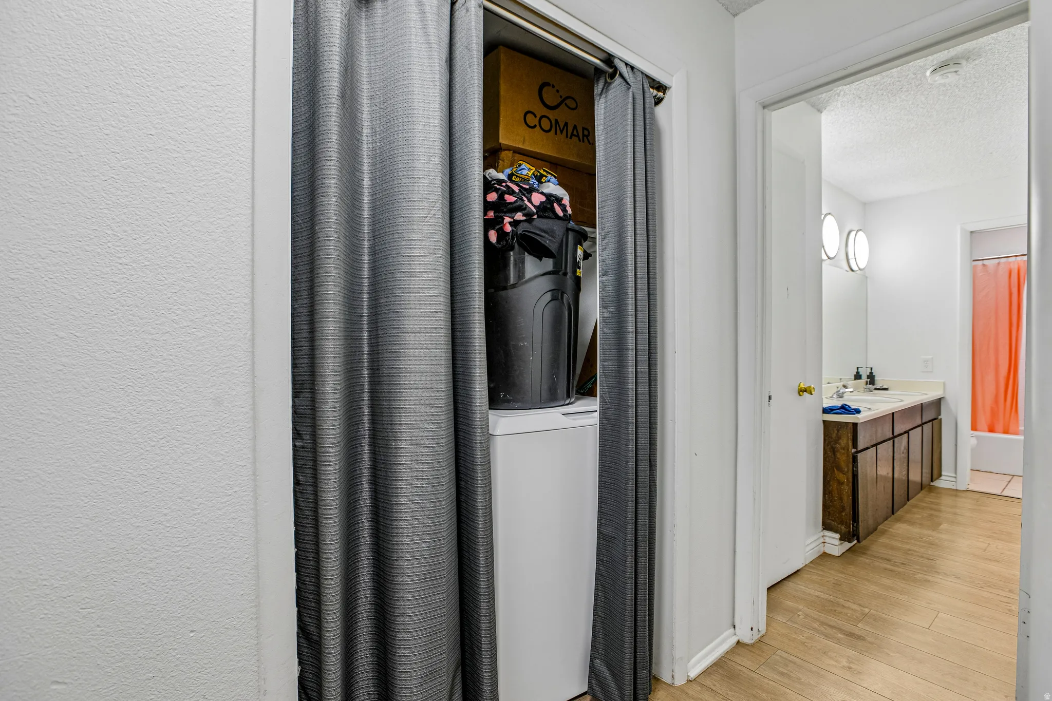 Dedicated laundry area with a white appliance