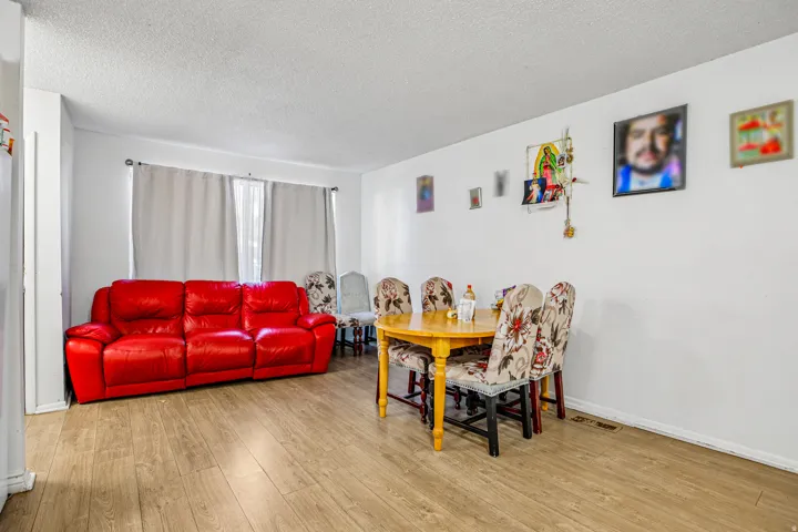 Wood-finish flooring throughout, complemented by white walls