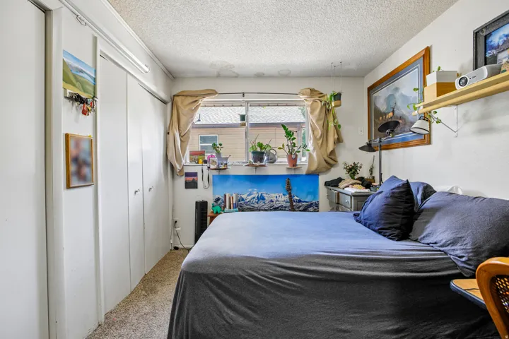 Wall-to-wall carpeting and multiple built-in closets with bi-fold doors