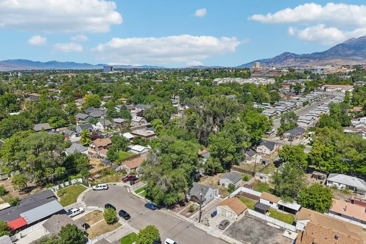 Residential neighborhood with abundant mature trees and distant mountain ranges