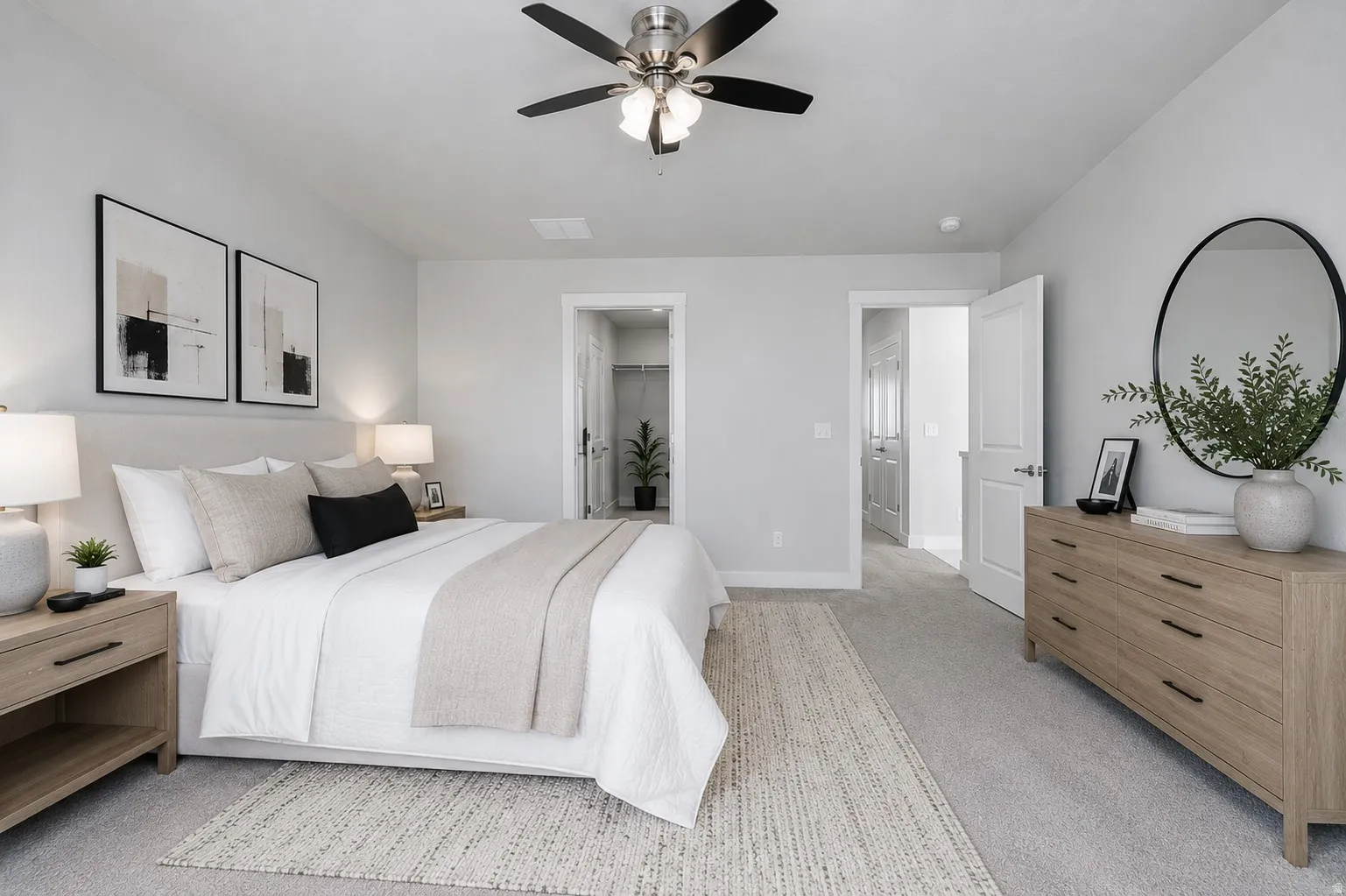Owners bedroom with wonderful natural light, neutral wall paint, ceiling fan with brushed nickel accents, neutral new carpet flooring, recessed lighting, and white interior doors.