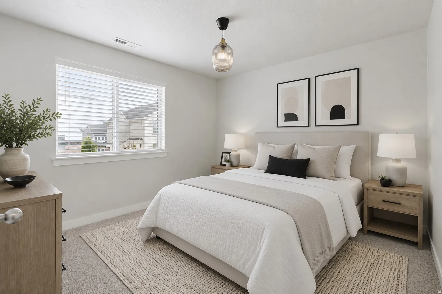 Neutral toned bedroom with new carpet flooring, a window with blinds, and a suspended modern ceiling fixture.