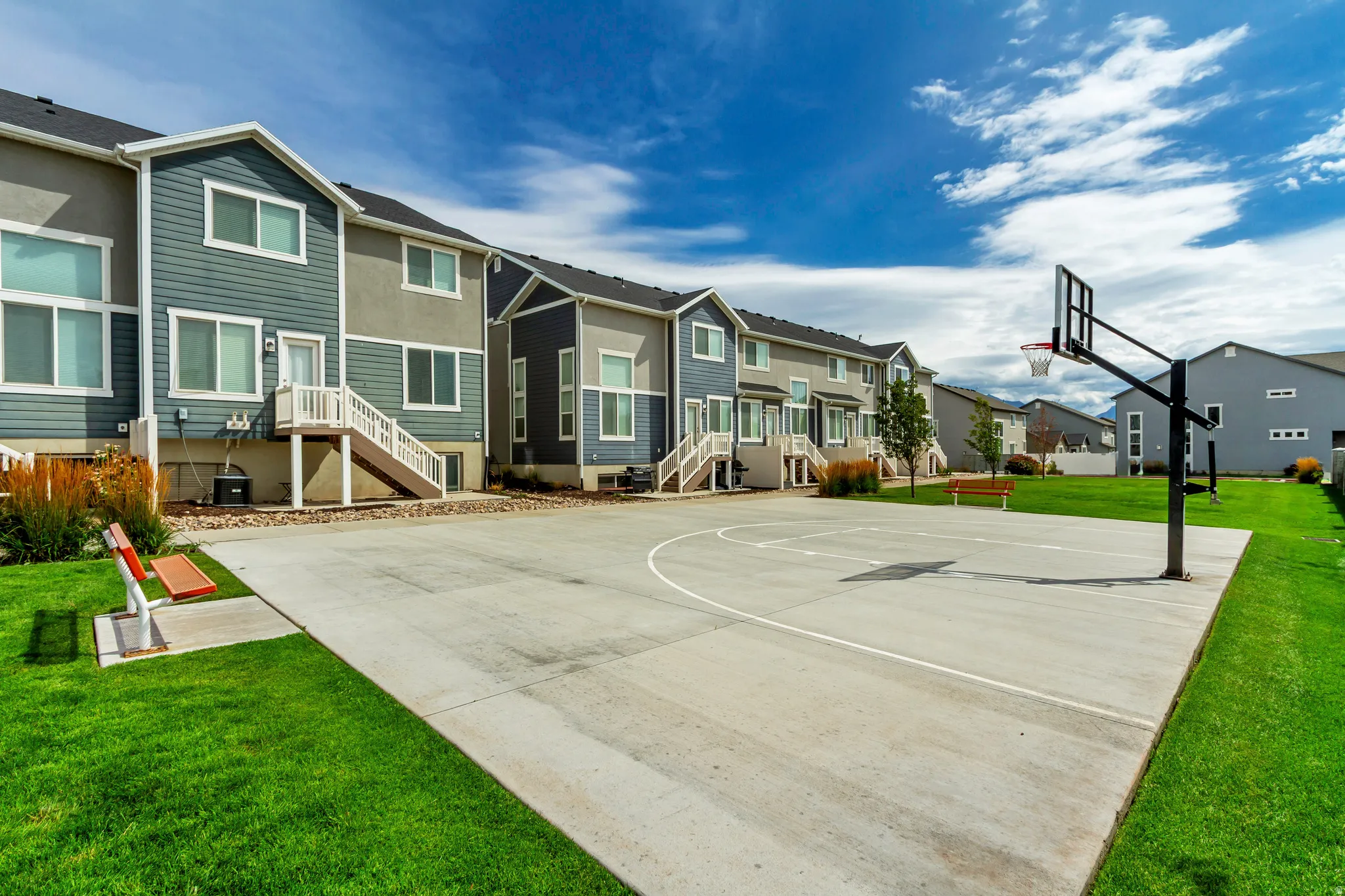Multi-level residences with contrasting siding and stucco facades.