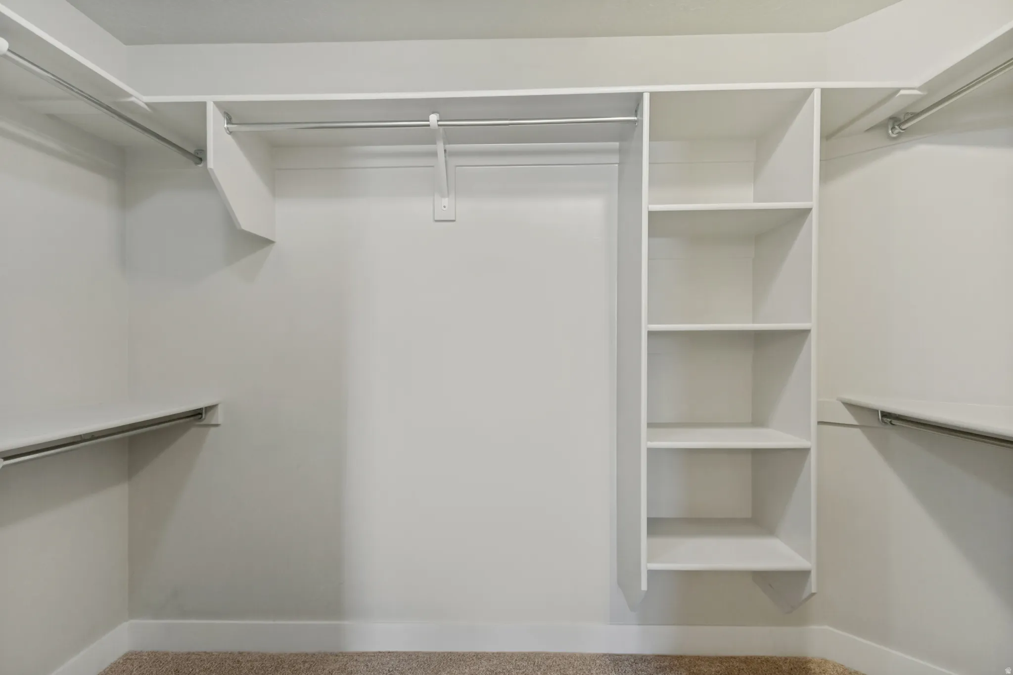Integrated shelving unit, multiple hanging rods, and built-in upper shelving. All rooms have large closets for storage.