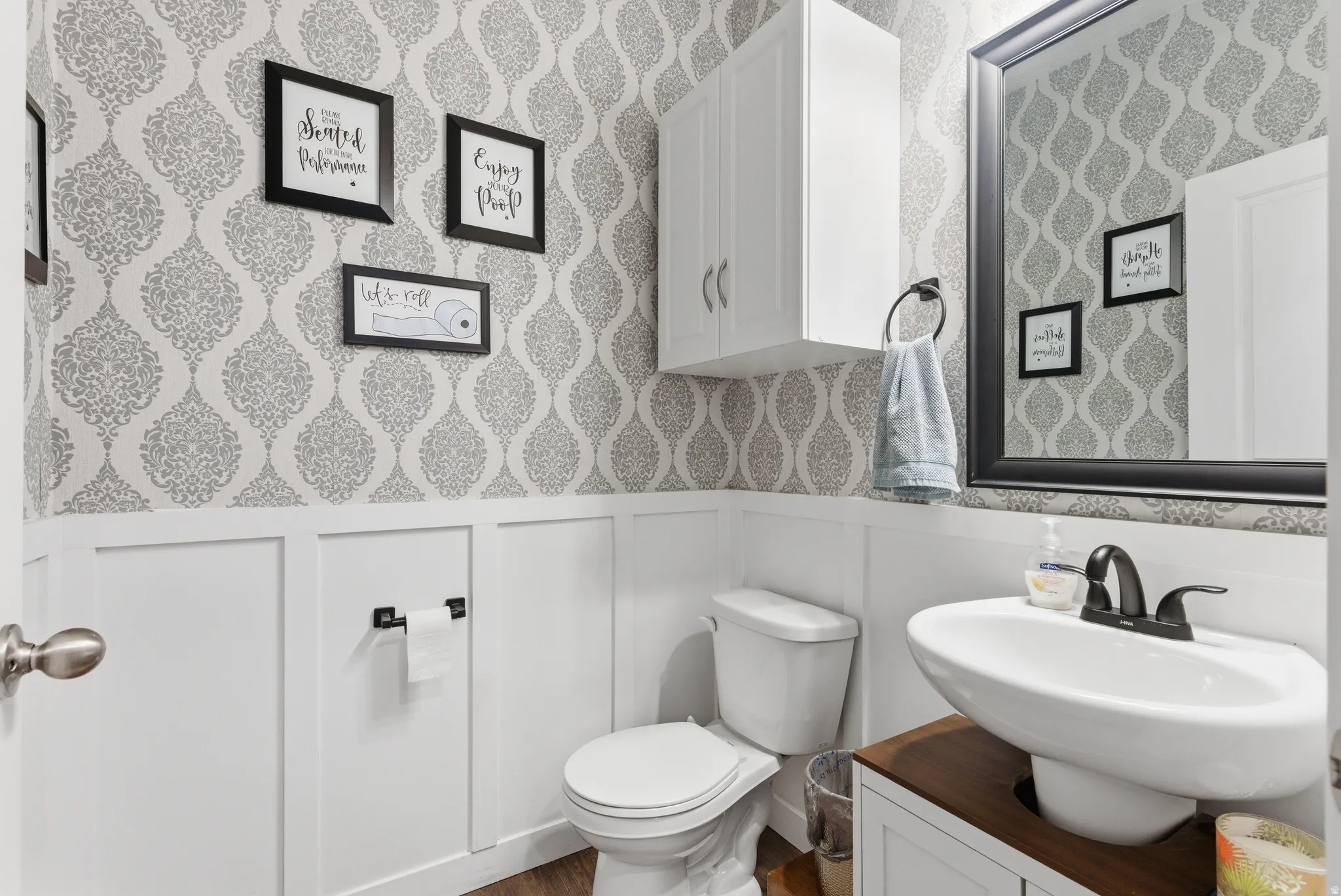 Board and batten wainscoting with patterned wallpaper