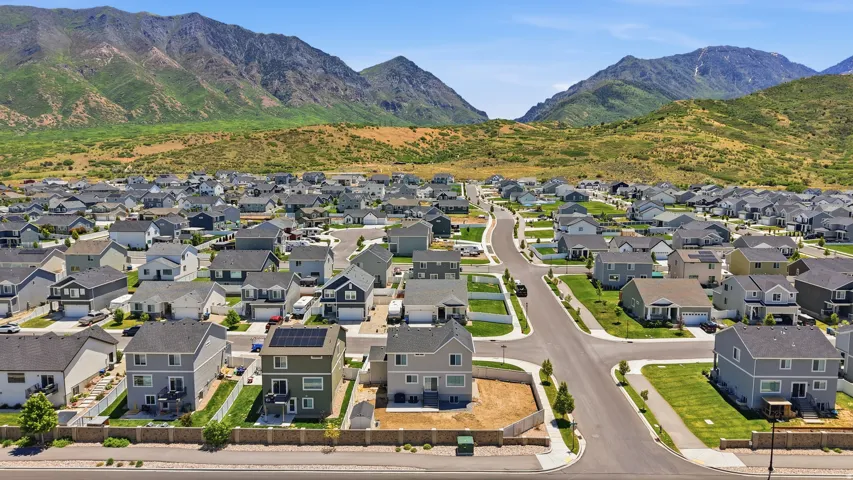 Residential development with paved roads and mountain backdrop