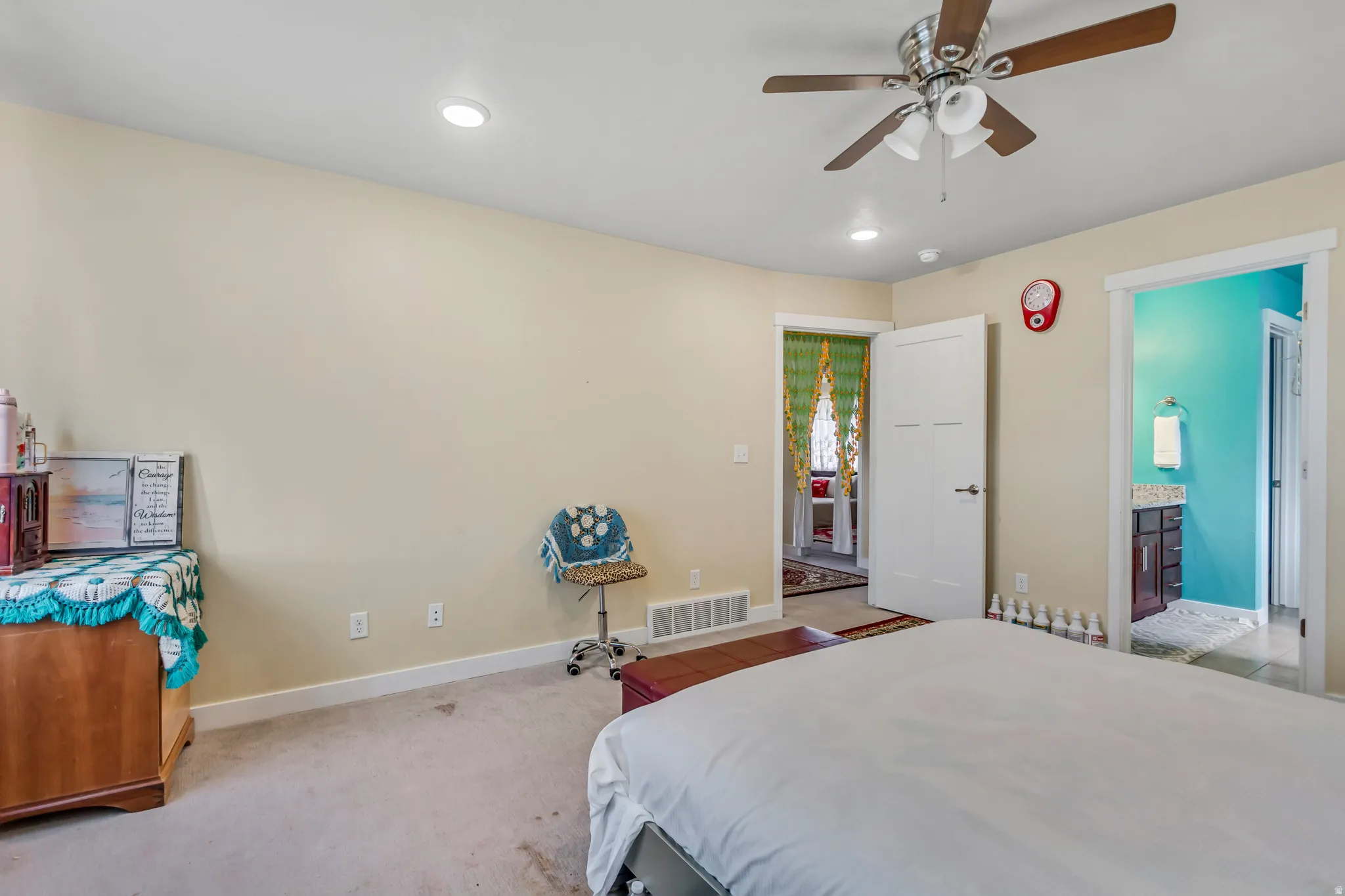 Recessed lighting, ceiling fan, white paneled doors, and light-colored carpeting