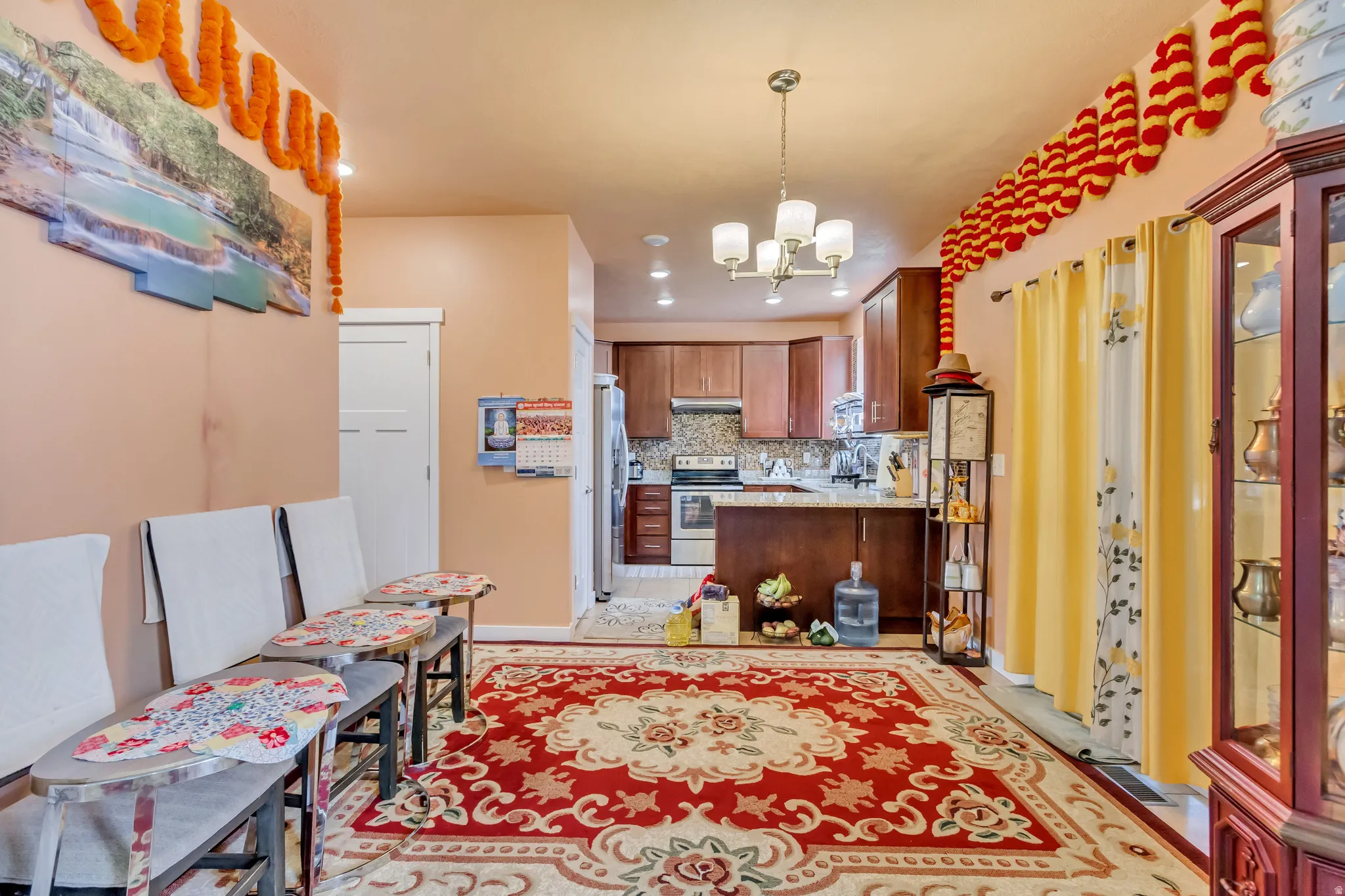Kitchen featuring wood-finish cabinetry, granite countertops, and stainless steel appliances