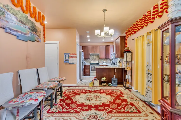 Kitchen featuring wood-finish cabinetry, stainless steel appliances, and a built-in island