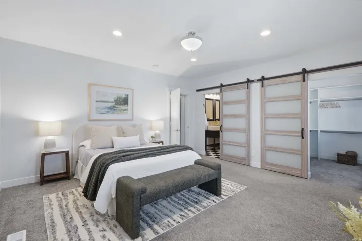 Large primary bedroom with en-suite and large walk-in closet.
